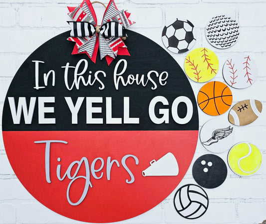 In this house We Yell Door Hanger