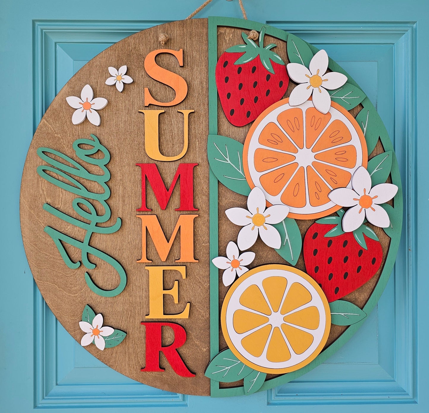 Decorative wall art with 'Summer' text and fruits on a blue background