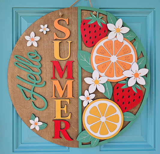 Decorative wall art with 'Summer' text and fruits on a blue background