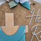 He is Risen Cross Door Hanger