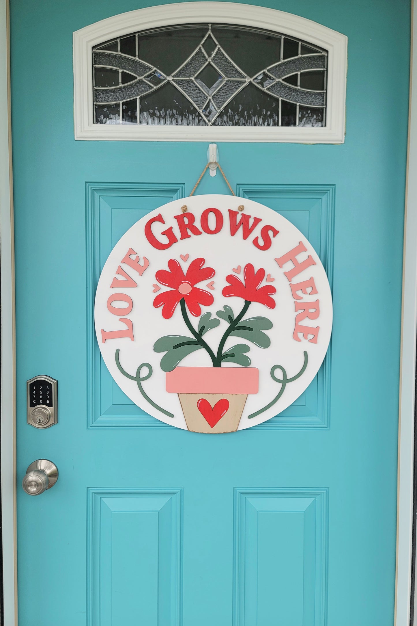 Love Grows Here Door Hanger