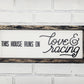 This house runs on Love & Racing Sign